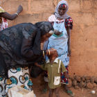 A Nigerian child is given the polio vaccine A Nigerian child is given the polio vaccine