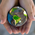 A child holds a model of the planet
