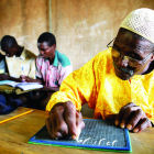 A man taking a literacy class in Burkina Faso