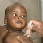 A nurse vaccinating a baby at a Mozambique clinic