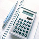 Calculator, pen and calendar