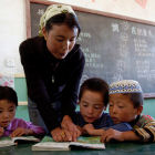 Teacher and children in classroom, China
