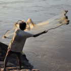 A fisherman on the Mekong River