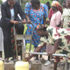 Women operating foot water pump in Kenya