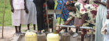 Women operating foot water pump in Kenya - Flickr/waterdotorg