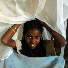 Girl with bed net, Ethiopia