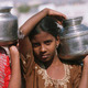 Girls carrying water in India