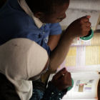 Girls reading with solar lights