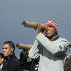 People looking through a homemade telescope