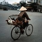 A man goes to market to sell his chickens, Vietnam