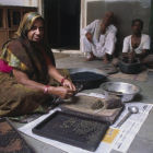 Woman makes Ayurvedic herbal pills