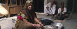Woman makes Ayurvedic herbal pills