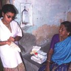 A doctor, and seated patient inside
