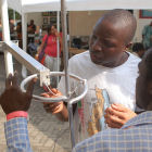Two Africans at a 'maker fair' in Ghana