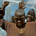 Children playing under bednet
