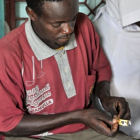 A man taking TB drugs in Tanzania, Africa