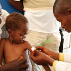 Child examined for malnourishment, DR Congo Child examined for malnourishment, DR Congo