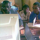 Men and woman at a computer