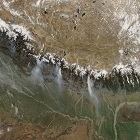 On March 12, 2009, the Moderate Resolution Imaging Spectroradiometer (MODIS) on NASA’s Aqua satellite caught a glimpse of a relatively rare event: large–scale forest fires in the Himalaya Mountains of