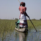 A woman on a canoe in Okavango Delta, Botswana