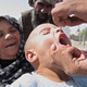 Child receiving oral polio vaccine