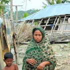 People with house damage from cyclone Sidr, Bangladesh. People with house damage from cyclone Sidr, Bangladesh.