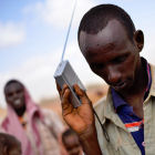 Man uses radio to listen to drought warnings