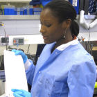 A lab worker with a RDT test