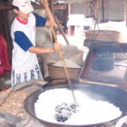 A man cooking rice in Vietnam