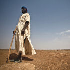 A herder in Mauritania searches in vain for fertile grazing land