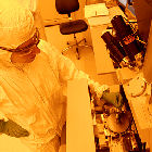 Scientist with nanofabrication instrument