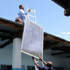 Men installing solar panels in Tanzania
