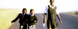 Children run to school in Kwa-Zulu Natal, South Africa by Flickr/World Bank Photo Collection