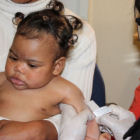 Girl gets a TB vaccine in South Africa