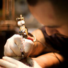 A tattoo artist at work