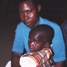 A Ugandan mother with her child who has malaria