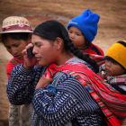 A woman uses a mobile phone in Central America