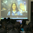Women scientists at a conference in India speaking to astronaut Sunita Williams