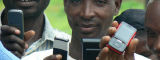 Farmers with mobile phones - Flickr/IICD