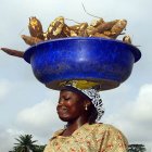 Woman carrying cassava Woman carrying cassava