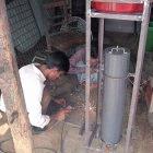 Setting up an arsenic removal filter in an iron container, Bangladesh