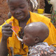 A baby eating porridge