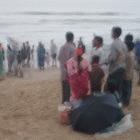 Crowds gather on a Mumbai beach