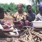 Women peel cassava in Ghana