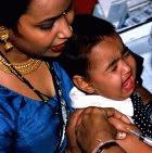A child being immunised in Delhi, India