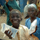 Boy carrying clean water in Nigeria