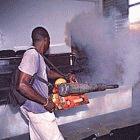 Spraying insecticide to kill mosquitoes that spread dengue