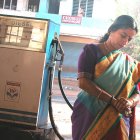 Woman at diesel station