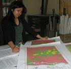 A researcher studies geohazard maps in the Philippines
