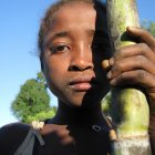 Girl with sugar cane